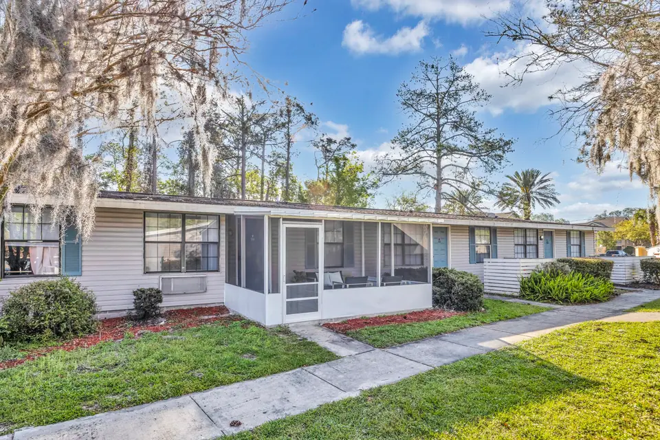 A landscaped apartment exterior at Jax Bay in Jacksonville, Florida.