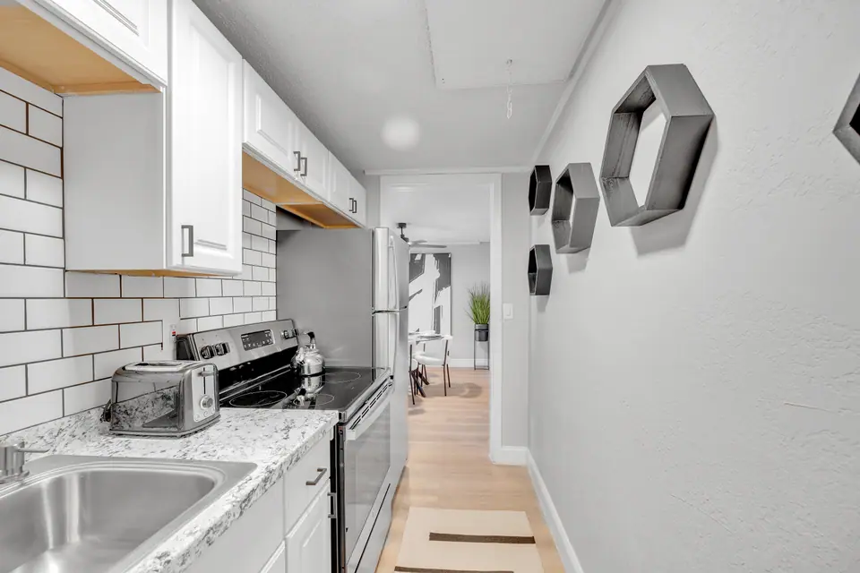 A renovated galley kitchen at Jax Bay in Jacksonville, Florida.