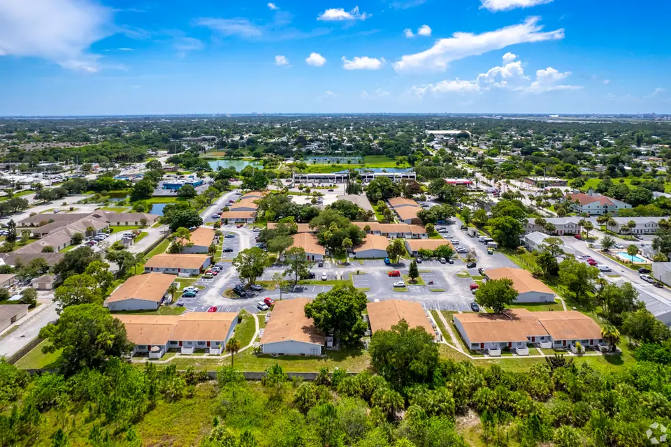 An aerial view of Palm Harbor Villas and its tree-lined grounds in Melbourne, Florida.