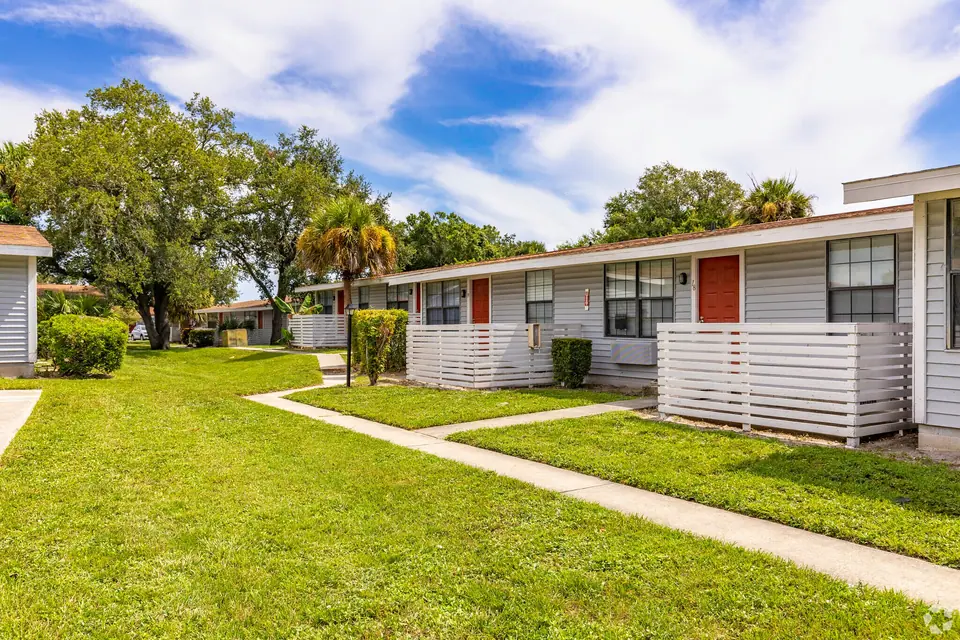 Patio-lined apartment homes at Palm Harbor Villas in Melbourne, Florida.